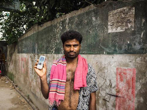 Man holding a mobile phone, Bangladesh
